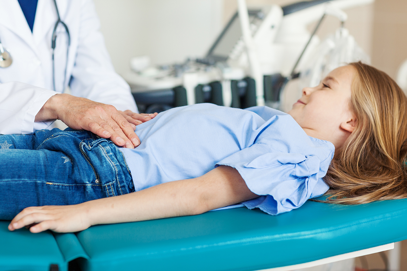 Background image : gastroenterology examination of a little girl